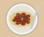 Spaghetti coated with Bolognese sauce, Parmesan and fresh basil leaves