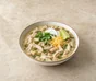 White chicken chilli with white beans, green peppers, soured cream, cheddar, coriander, lime and tortilla chips